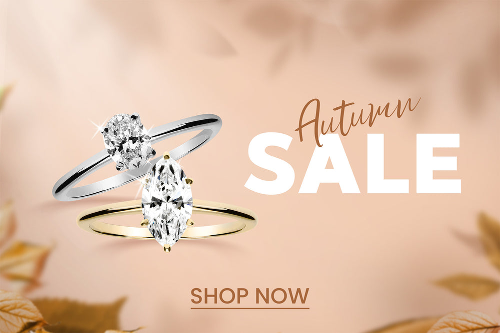 Syksyinen graafinen banneri, jossa on kaksi timanttisormusta ja alareunassa Shop Now -painike.