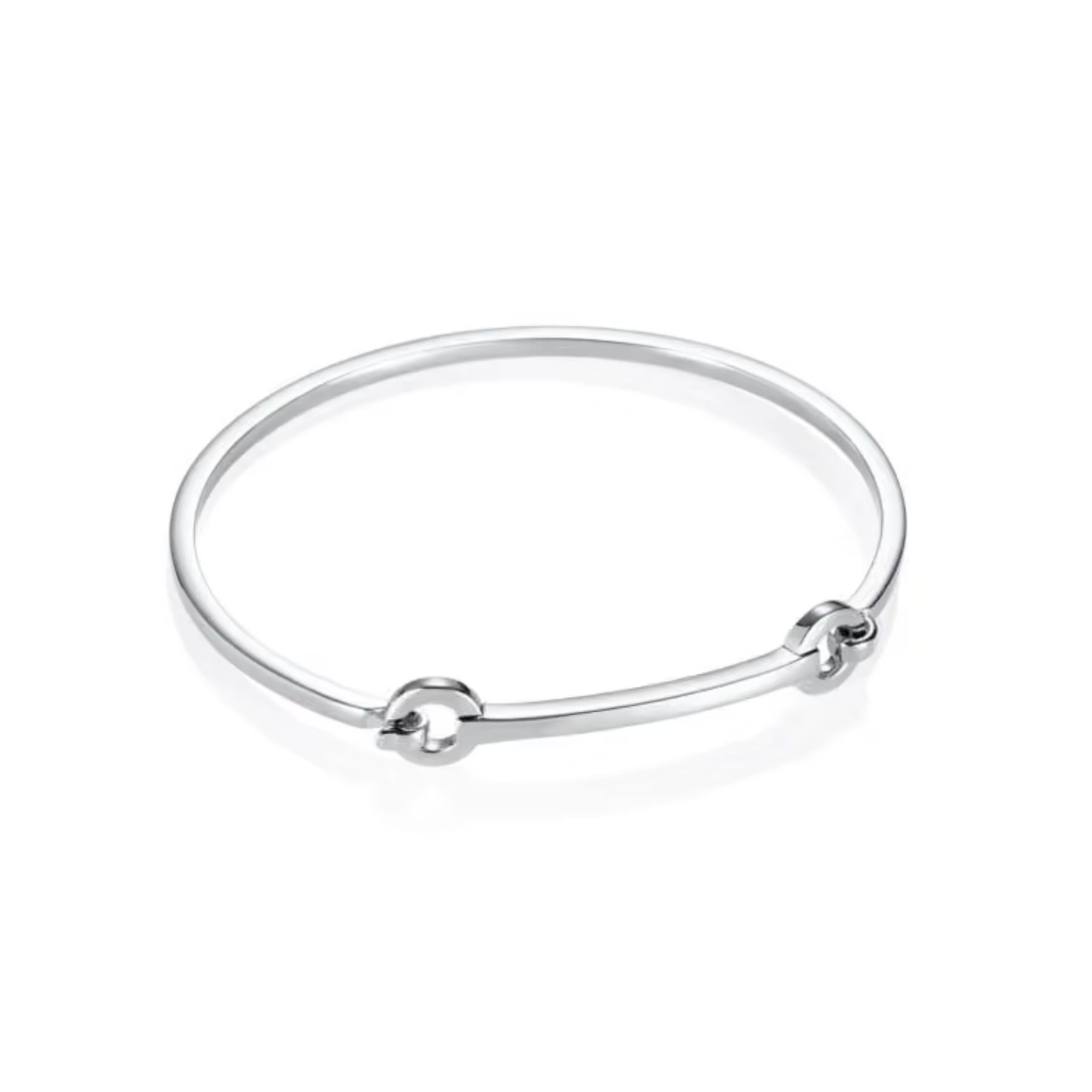 Efva Attlingin kiiltävä hopeinen cuff-rannerengas, jossa on siro pyöreä muoto ja kaksi pyöreää koristeosaa.