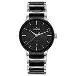 Rado rannekello mustalla kellotaululla, teräksen ja mustan sävyisellä metallirannekkeella sekä päivämääränäytöllä