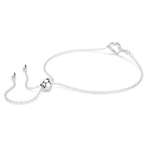 Swarovski valkoinen kristallirannekoru, jossa säihkyvä ketju, pyöreä koristepallo ja sydämenmuotoinen lukko.