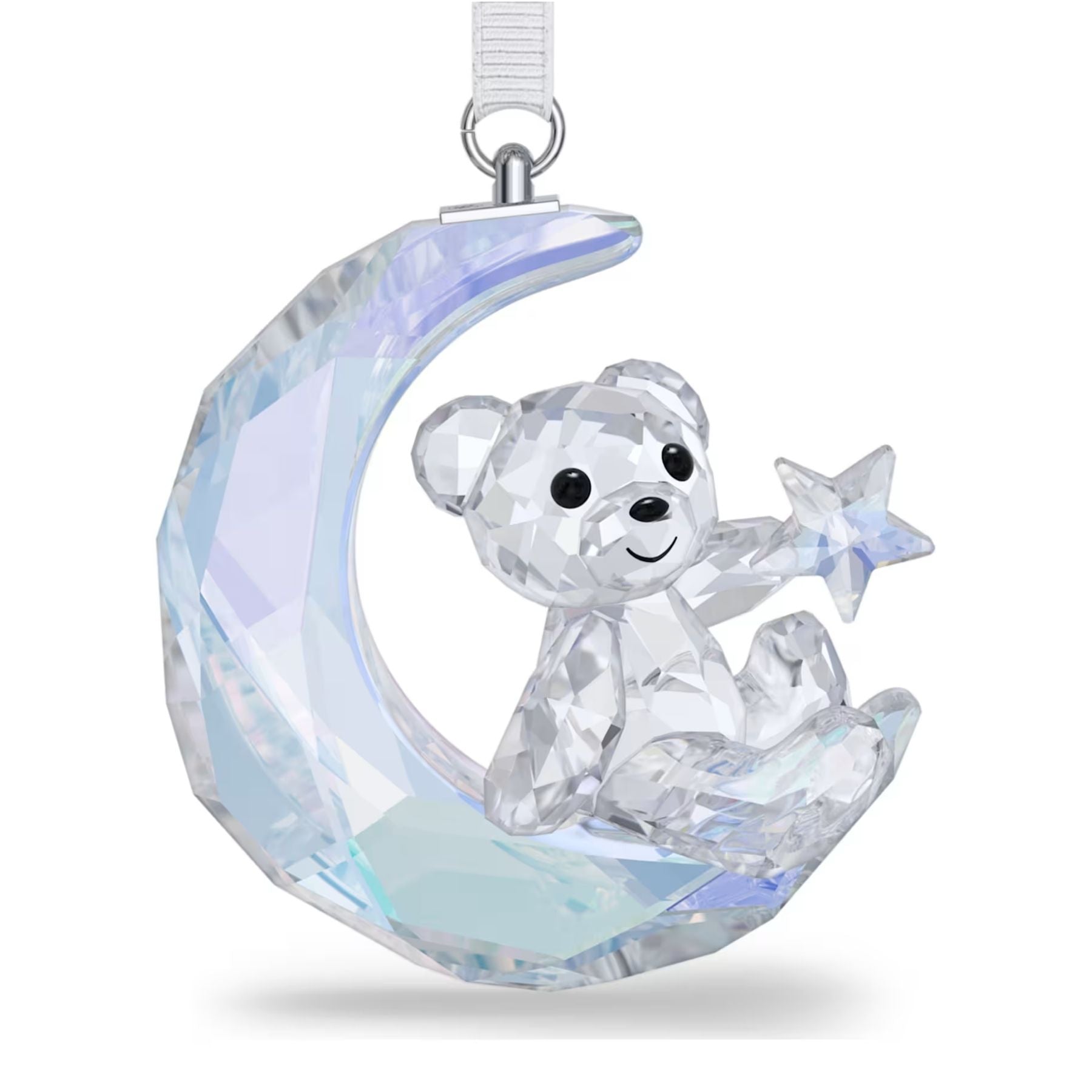 Swarovski kristallikoriste, jossa kirkas nalle istuu viisteisellä kuunsirpillä ja pitelee tähteä