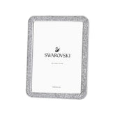 Hopeanvärinen Swarovski-kehys 10 x 15 cm koolle, pyöristetyt reunat ja säihkyvä kristallikoristelu.