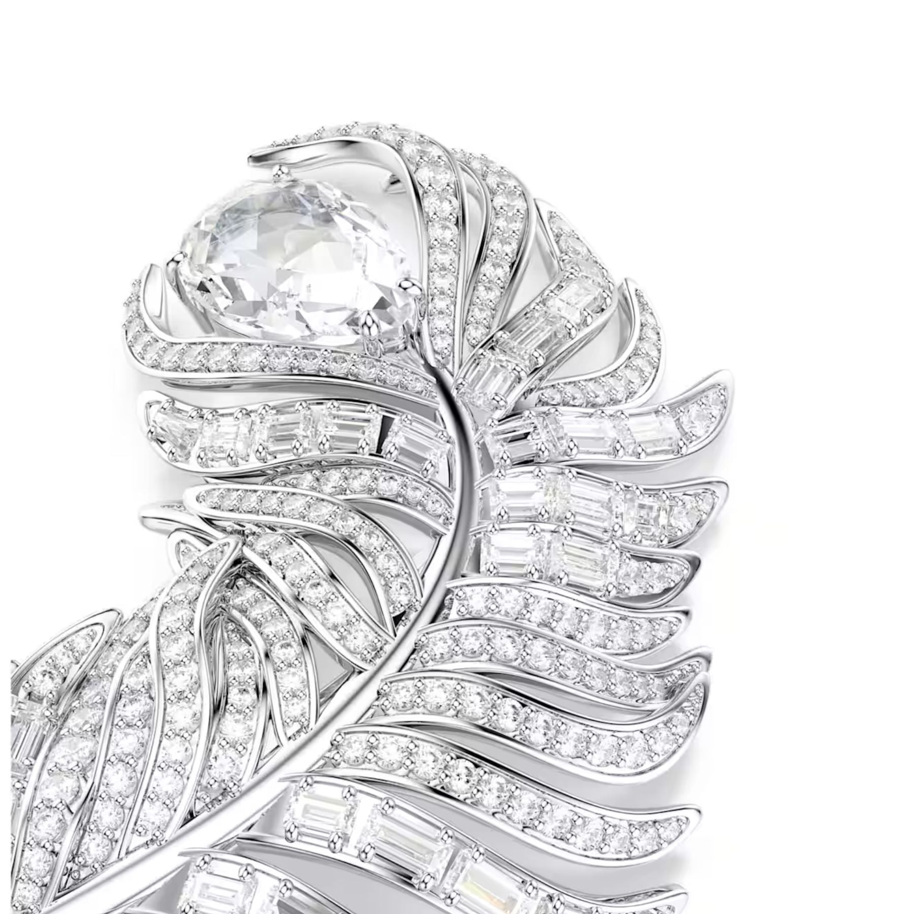 Swarovski höyhenenmuotoinen rintakoru vaaleaksi rodinoitua metallia ja säihkyviä kirkkaita zirkoneja lähikuvassa