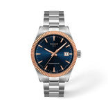 Tissot Gentleman rannekello sinisellä kellotaululla, ruusukultaisella kehyksellä, teräsrannekkeella ja päivämääränäytöllä