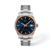 Tissot Gentleman rannekello sinisellä kellotaululla, ruusukultaisella kehyksellä, teräsrannekkeella ja päivämääränäytöllä